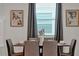 Dining area with gray chairs and modern artwork at 866 Paradise Dr, Davenport, FL 33897