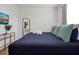 Spacious bedroom with a large bed and a gold accent table at 866 Paradise Dr, Davenport, FL 33897