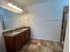 Double vanity bathroom with granite countertop and shower at 9026 Paolos Pl, Kissimmee, FL 34747