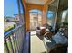 Relaxing balcony with wicker furniture and string lights at 12020 Villanova Dr # 101, Orlando, FL 32837