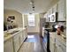 Well-lit kitchen with stainless steel appliances and white cabinets at 12020 Villanova Dr # 101, Orlando, FL 32837