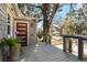 Small deck with modern gray railings and potted plants at 1901 University Dr, Orlando, FL 32804