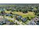 Aerial view of house next to golf course, showcasing neighborhood at 1965 Fairway Loop, Kissimmee, FL 34746