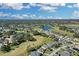 Home situated on golf course with water views in background at 1965 Fairway Loop, Kissimmee, FL 34746