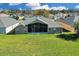 Aerial view of house showcasing large backyard at 1965 Fairway Loop, Kissimmee, FL 34746