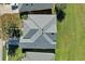 Housetop view with gray roof and landscaping at 1965 Fairway Loop, Kissimmee, FL 34746