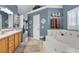 Spa-like bathroom with a large garden tub and double vanity at 1965 Fairway Loop, Kissimmee, FL 34746