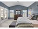 Spacious Primary bedroom with high ceilings, and access to a private patio at 1965 Fairway Loop, Kissimmee, FL 34746