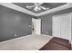Bright bedroom with ceiling fan and double-door closet at 1965 Fairway Loop, Kissimmee, FL 34746