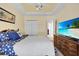 Guest bedroom with large TV and ample closet space at 1965 Fairway Loop, Kissimmee, FL 34746