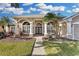 Attractive one-story home with columns and nicely landscaped yard at 1965 Fairway Loop, Kissimmee, FL 34746