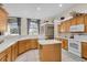 Spacious kitchen boasts ample cabinetry, an island, and modern appliances at 1965 Fairway Loop, Kissimmee, FL 34746