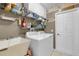 Laundry room with washer, dryer, and utility sink at 1965 Fairway Loop, Kissimmee, FL 34746