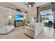 Relaxing living room with a sofa, chaise lounge, and sliding glass doors to the patio at 1965 Fairway Loop, Kissimmee, FL 34746