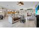 Comfortable living room with beige sofa, chaise lounge, and large flat-screen TV at 1965 Fairway Loop, Kissimmee, FL 34746