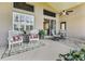 Relaxing patio with seating area and potted plants at 1965 Fairway Loop, Kissimmee, FL 34746