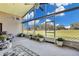 Large screened porch with golf course view and ceiling fans at 1965 Fairway Loop, Kissimmee, FL 34746