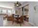 Bright breakfast nook with table and chairs, adjacent to living room at 27000 Nature View St, Leesburg, FL 34748