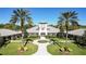 Community clubhouse with courtyard and palm trees at 27000 Nature View St, Leesburg, FL 34748