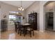 Elegant dining room with a charming chandelier and large windows at 27000 Nature View St, Leesburg, FL 34748