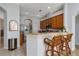 Well-equipped kitchen with wood cabinets and granite countertops at 27000 Nature View St, Leesburg, FL 34748