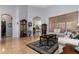 Comfortable living room with a view into the kitchen and access to other rooms at 27000 Nature View St, Leesburg, FL 34748