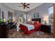 Spacious main bedroom with king-size bed and access to a patio at 27000 Nature View St, Leesburg, FL 34748