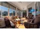 Relaxing sunroom with ample seating and large windows at 27000 Nature View St, Leesburg, FL 34748