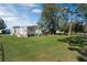 Spacious backyard with grassy lawn and storage shed at 2713 Rivkin Dr, Kissimmee, FL 34758