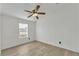 Well-lit bedroom with ceiling fan and window at 2713 Rivkin Dr, Kissimmee, FL 34758