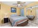 Bright bedroom with ceiling fan and mirrored closet doors at 2743 N Poinciana Blvd # 59, Kissimmee, FL 34746