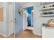 Condo entry with wreath and decorative shelves at 2743 N Poinciana Blvd # 59, Kissimmee, FL 34746