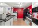 Efficient kitchen with black appliances and granite counters at 2743 N Poinciana Blvd # 59, Kissimmee, FL 34746