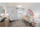 Charming Bedroom with a crib and rainbow wall decal at 3145 Emerald Acres Ln, Sanford, FL 32771