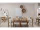 Modern dining room with a square table and four chairs, ready for Gathering meals at 3145 Emerald Acres Ln, Sanford, FL 32771