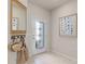 Bright entryway with tile flooring, a mirror, and coat hooks at 3145 Emerald Acres Ln, Sanford, FL 32771