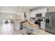 Open concept kitchen with stainless steel appliances and white cabinets at 3145 Emerald Acres Ln, Sanford, FL 32771