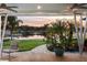 Serene patio with sunset view over the lake at 3870 W Stillwood Ln, Lake Mary, FL 32746