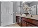 Double vanity bathroom with dark wood cabinets at 4685 Anson Ln, Orlando, FL 32814