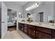 Double vanity bathroom with dark wood cabinets at 4685 Anson Ln, Orlando, FL 32814