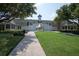 Charming community clubhouse with a manicured lawn at 4685 Anson Ln, Orlando, FL 32814