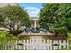 Private courtyard with brick pavers and blue chairs at 4685 Anson Ln, Orlando, FL 32814