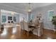 Bright dining room features hardwood floors and a view into the living room at 4685 Anson Ln, Orlando, FL 32814