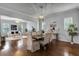 Bright dining room features hardwood floors and a view into the living room at 4685 Anson Ln, Orlando, FL 32814