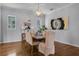Elegant dining room with hardwood floors and neutral color palette at 4685 Anson Ln, Orlando, FL 32814