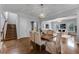 Open dining room with hardwood floors and view of staircase and living room at 4685 Anson Ln, Orlando, FL 32814