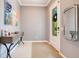 Bright entryway with decorative console table and large mirror at 4685 Anson Ln, Orlando, FL 32814