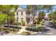 Two-story house with white picket fence, landscaping, and balcony at 4685 Anson Ln, Orlando, FL 32814