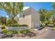 Detached garage with white door and landscaping at 4685 Anson Ln, Orlando, FL 32814