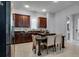 Modern kitchen with dark wood cabinets, granite countertops, and island at 4685 Anson Ln, Orlando, FL 32814
